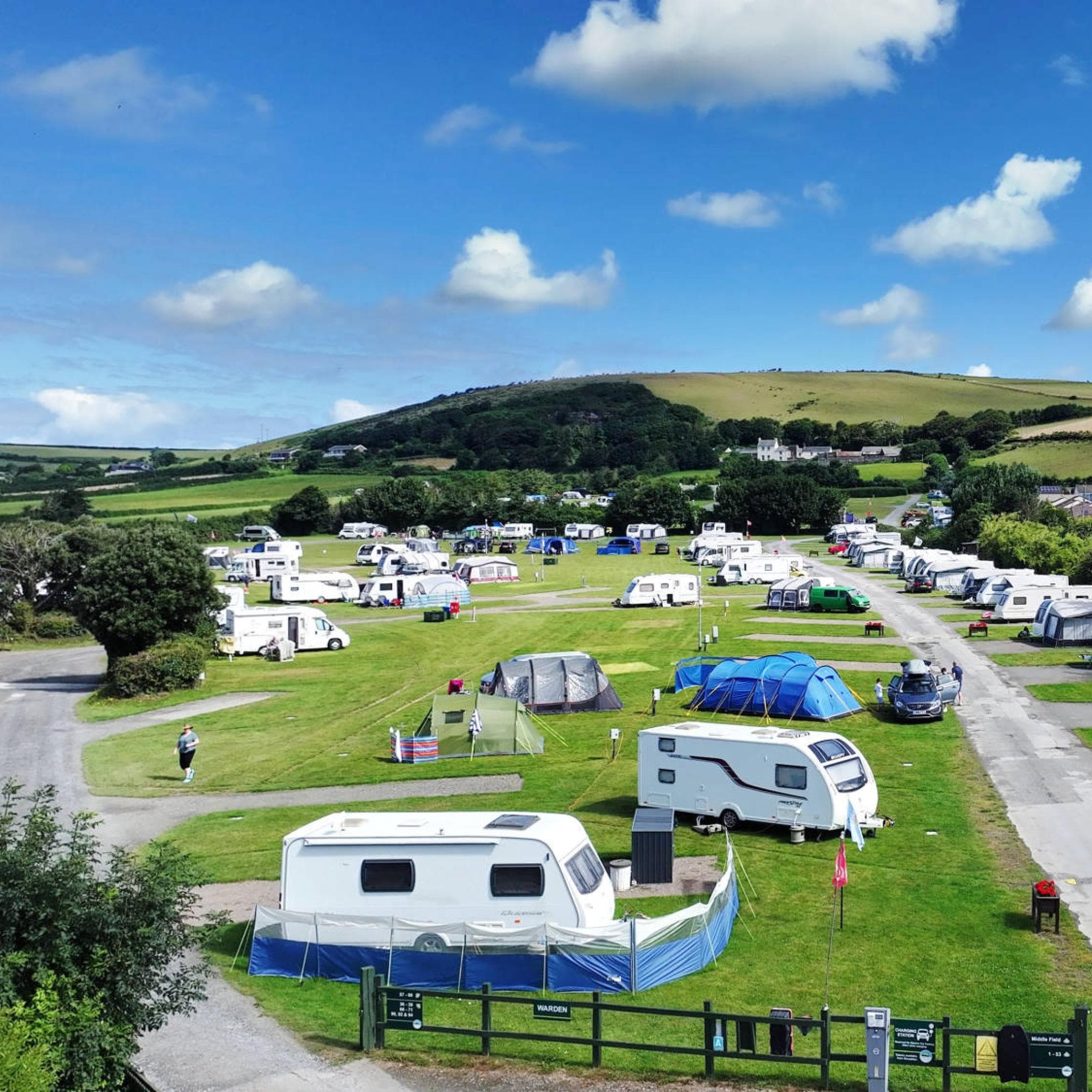 Caravans and campers at a UK holiday campsite, aerial view of pitches